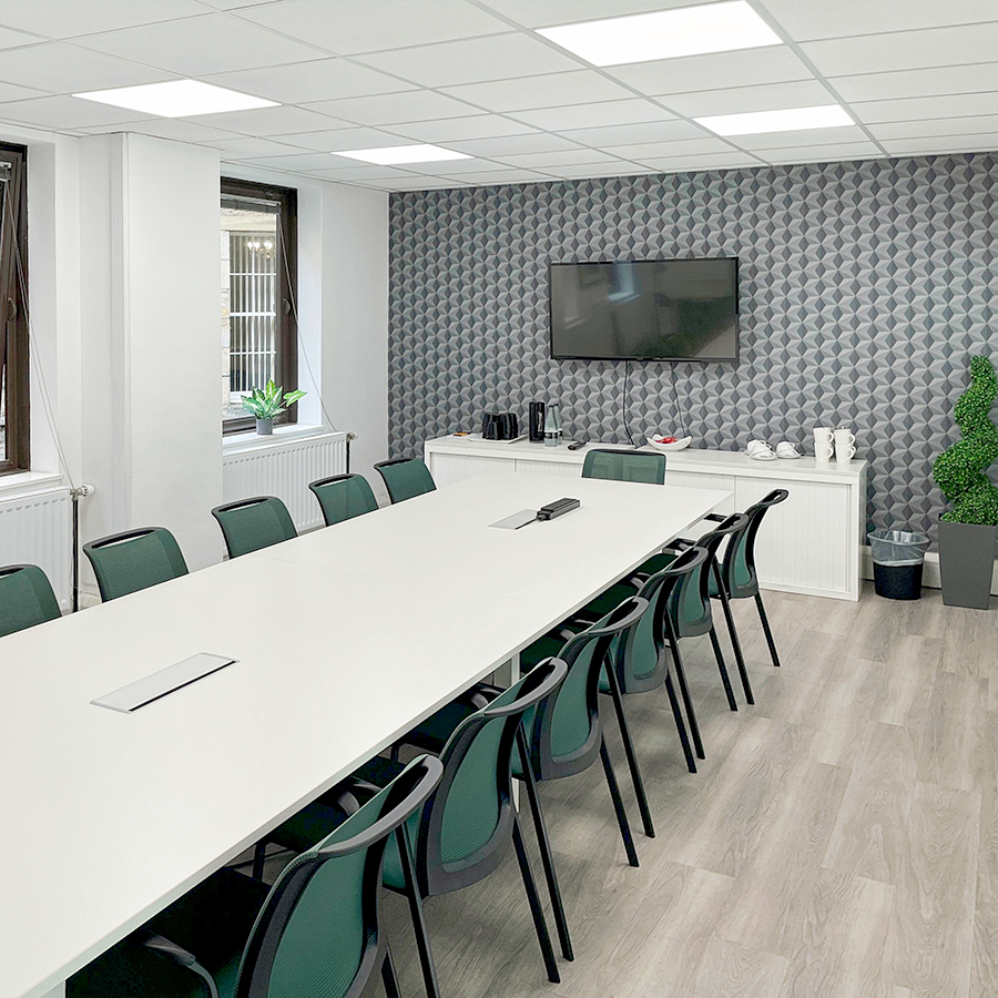 A spacious, modern lounge area with contemporary seating and decor