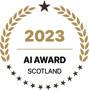 Gold laurel wreath circle badge indicating 2023 AI Award Scotland